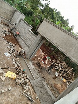 Main gate with overhead swimming pool at our head offices Namawojjolo, Mukono
